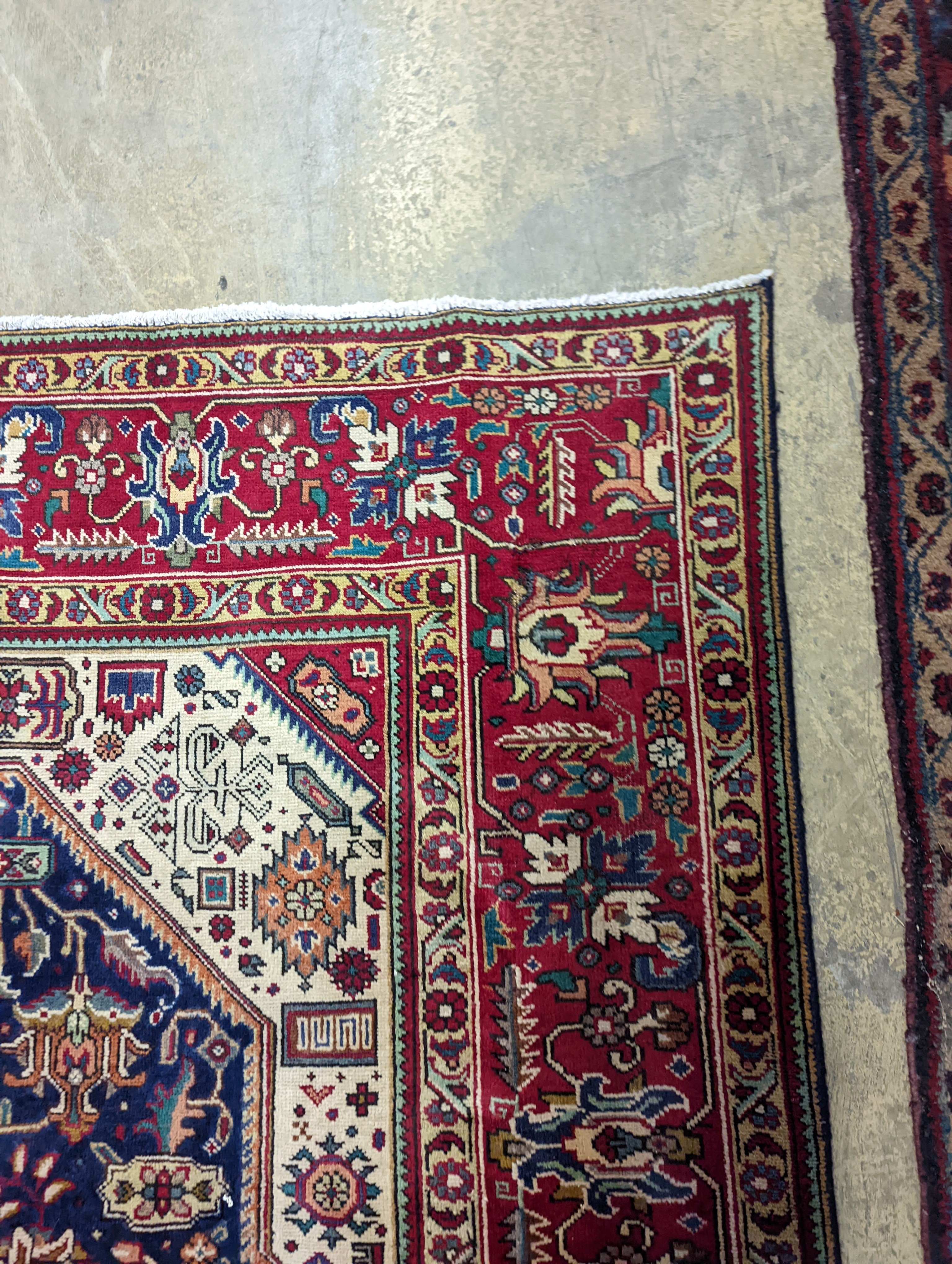 A Tabriz blue ground carpet, 290 x 200cm
